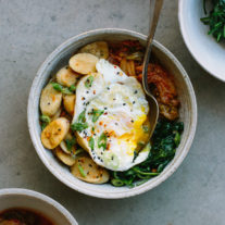 Korean Crispy Brown Rice Cakes with Kimchi, Spinach, and Fried Egg